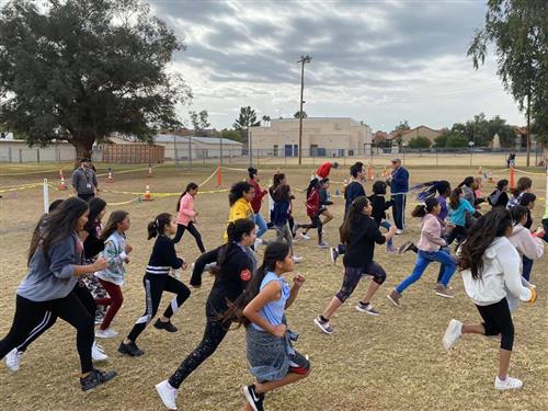 students run as part of the turkey trot